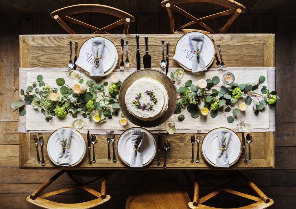 Table set for a cozy meal with simple yet elegant plates, cutlery, and fresh herbs, representing affordable and delicious dining options