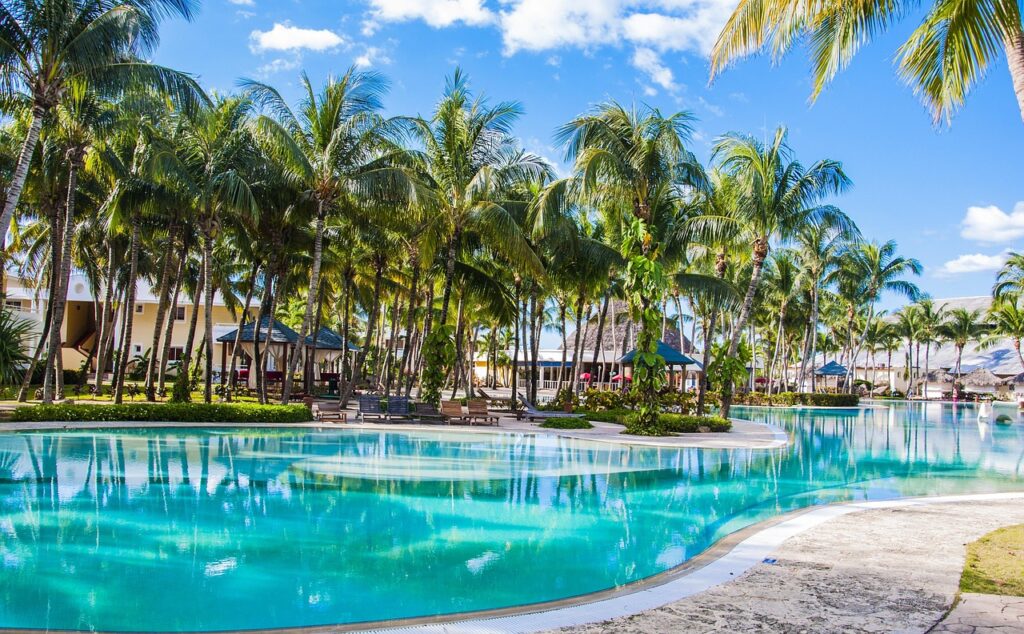 Secluded luxury resort at X’tan Ha with beachfront views, offering a peaceful retreat surrounded by palm trees and crystal-clear waters